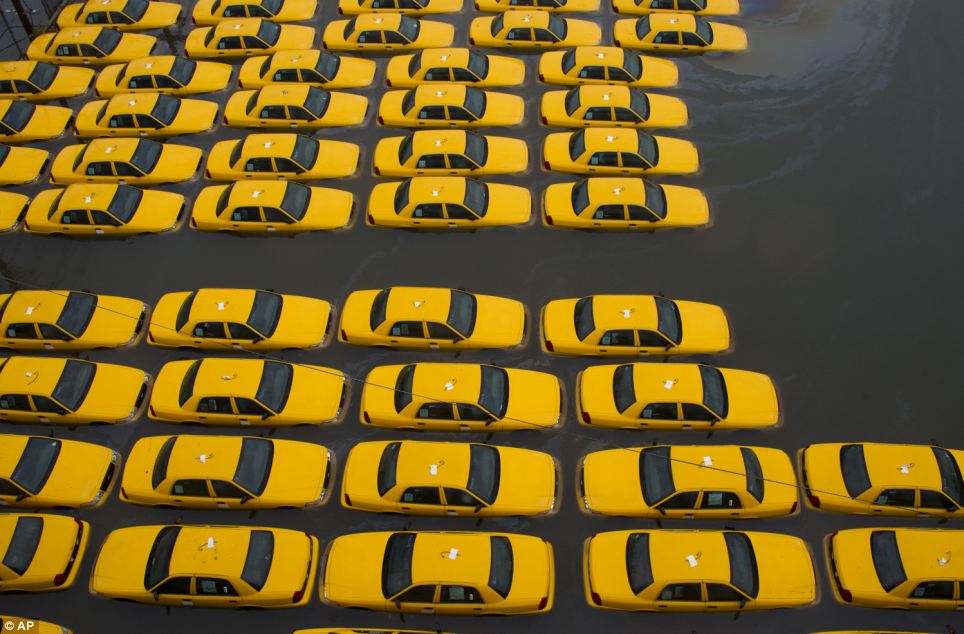 NYC cabs covered in water hurricane Sandy
